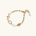 14K gold plated bracelet with freshwater pearls, filigree details, and mixed geometric elements on white background.