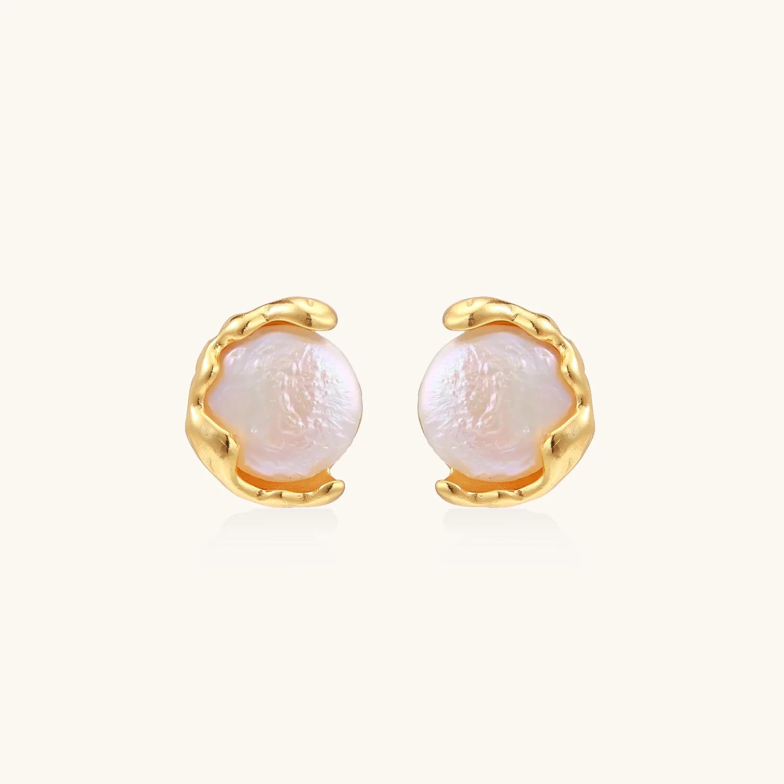 Gold vermeil studs with lustrous pink freshwater pearls in organic crescent settings