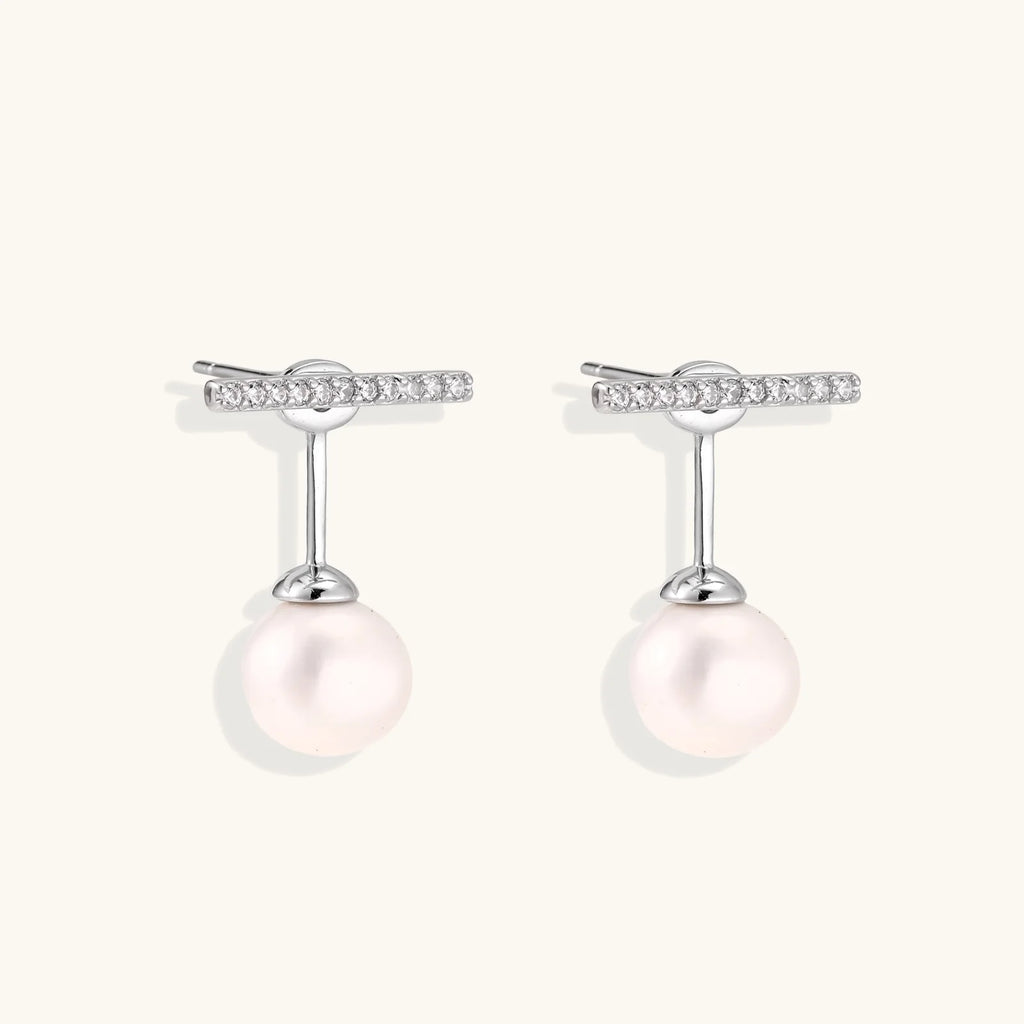 Rhodium-plated sterling silver ear jacket earrings with diamond-set horizontal bar and freshwater pearl drop
