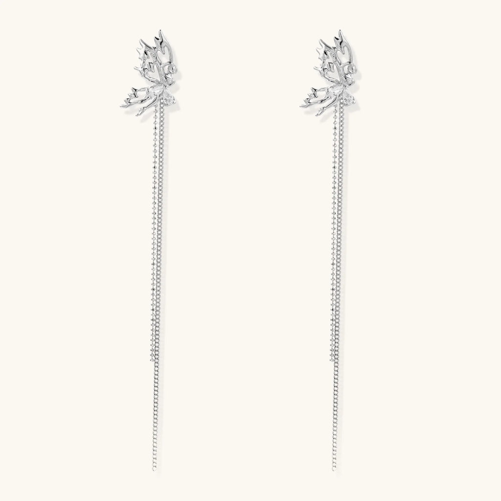 Silver-toned threader earrings featuring detailed fairy figure with wings and dual delicate chain strands, zirconia accents