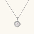 Cushion-shaped double halo pendant with 10mm freshwater pearl center on rhodium-plated sterling silver chain