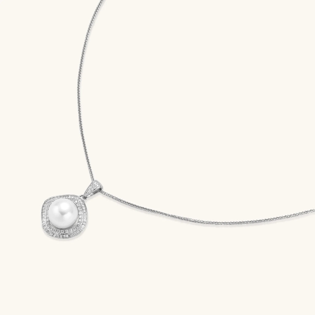 Cushion-shaped double halo pendant with 10mm freshwater pearl center on rhodium-plated sterling silver chain