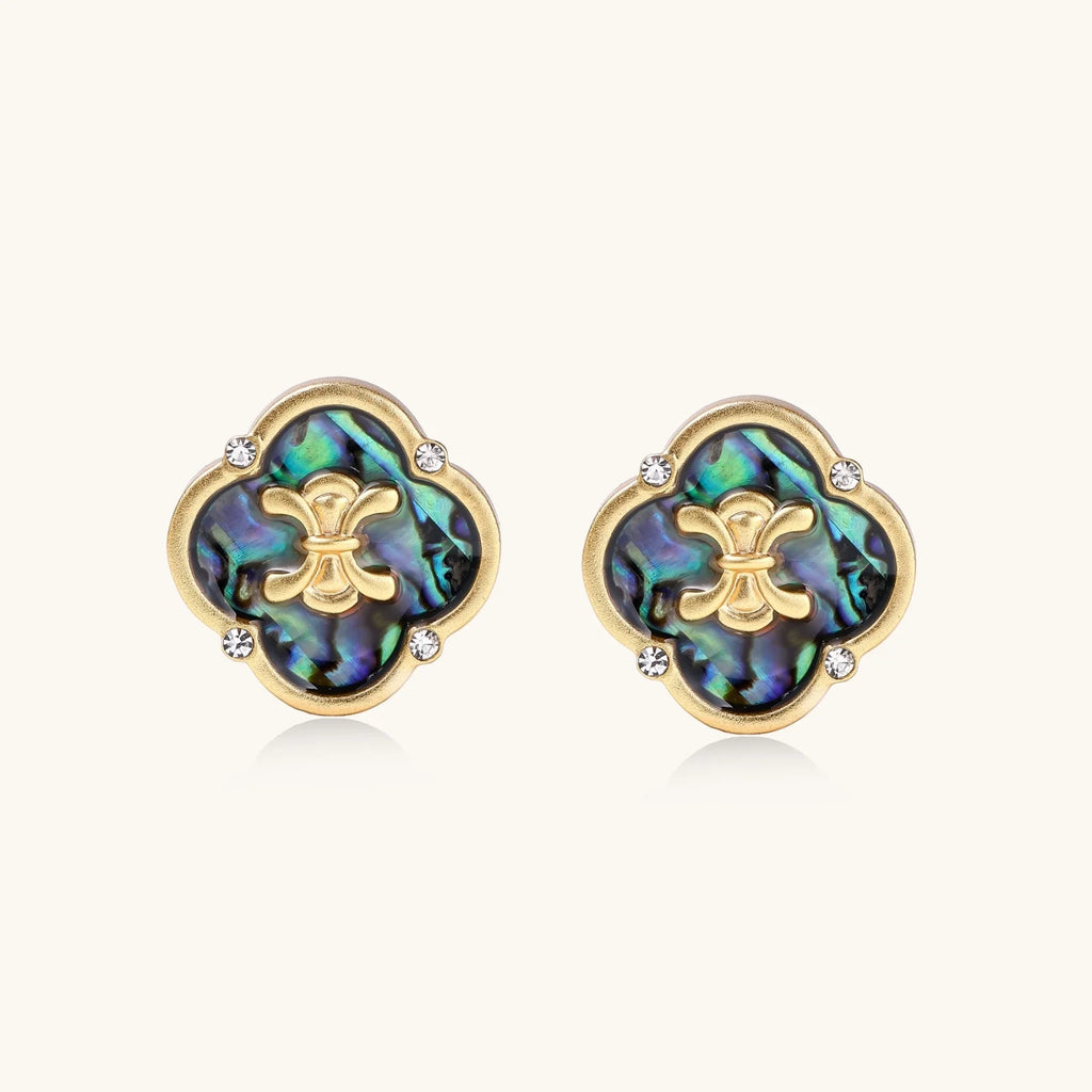 Gold quatrefoil stud earrings with iridescent abalone shell inlay and fleur-de-lis center, accented by four crystals