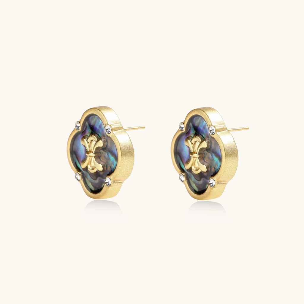 Gold quatrefoil stud earrings with iridescent abalone shell inlay and fleur-de-lis center, accented by four crystals